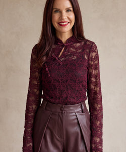 Bob & Bill bordeaux lace long-sleeve top with mandarin collar and keyhole detail worn by a smiling woman