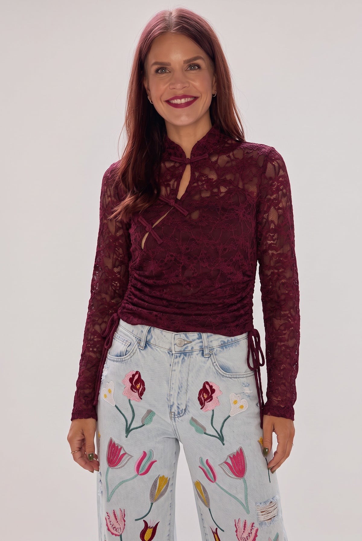 Bob & Bill bordeaux lace long-sleeve top with mandarin collar, keyhole cutout, and side-tie crop detail on a model.