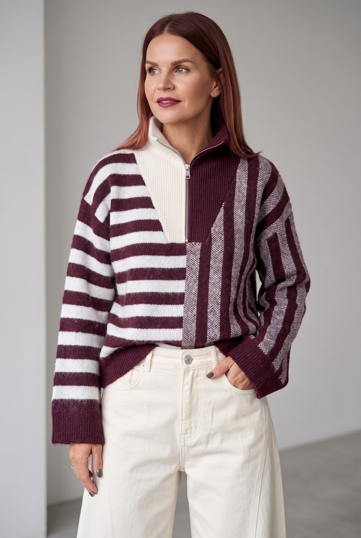 Bob & Bill Butch striped zipper pullover in purple and white worn by a woman with cream trousers