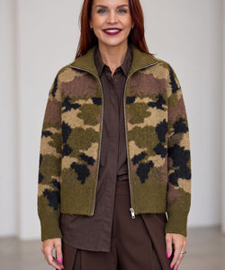Bob & Bill camo print knit cardigan with a front zipper, worn by a woman in a brown shirt and trousers.
