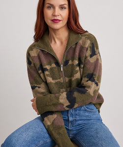 Bob & Bill camo print knit cardigan with a front zipper, worn by a woman with red hair against a neutral background.