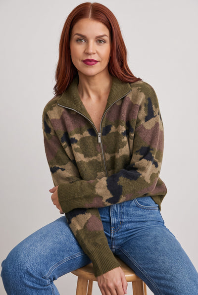 Bob & Bill camo print knit cardigan with a front zipper, worn by a woman with red hair against a neutral background.