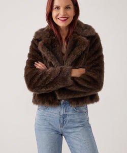 Woman wearing a Bob & Bill chocolate brown fuzzy faux fur jacket with an oversized collar and chunky fit