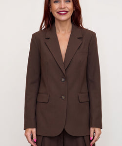 Bob & Bill oversized chocolate brown blazer with button closure and front pockets worn by a smiling woman