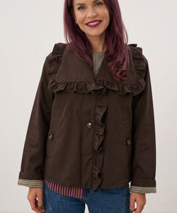 Bob & Bill YAS coffee bean brown short trench coat with ruffle collar and button closure worn by a smiling woman