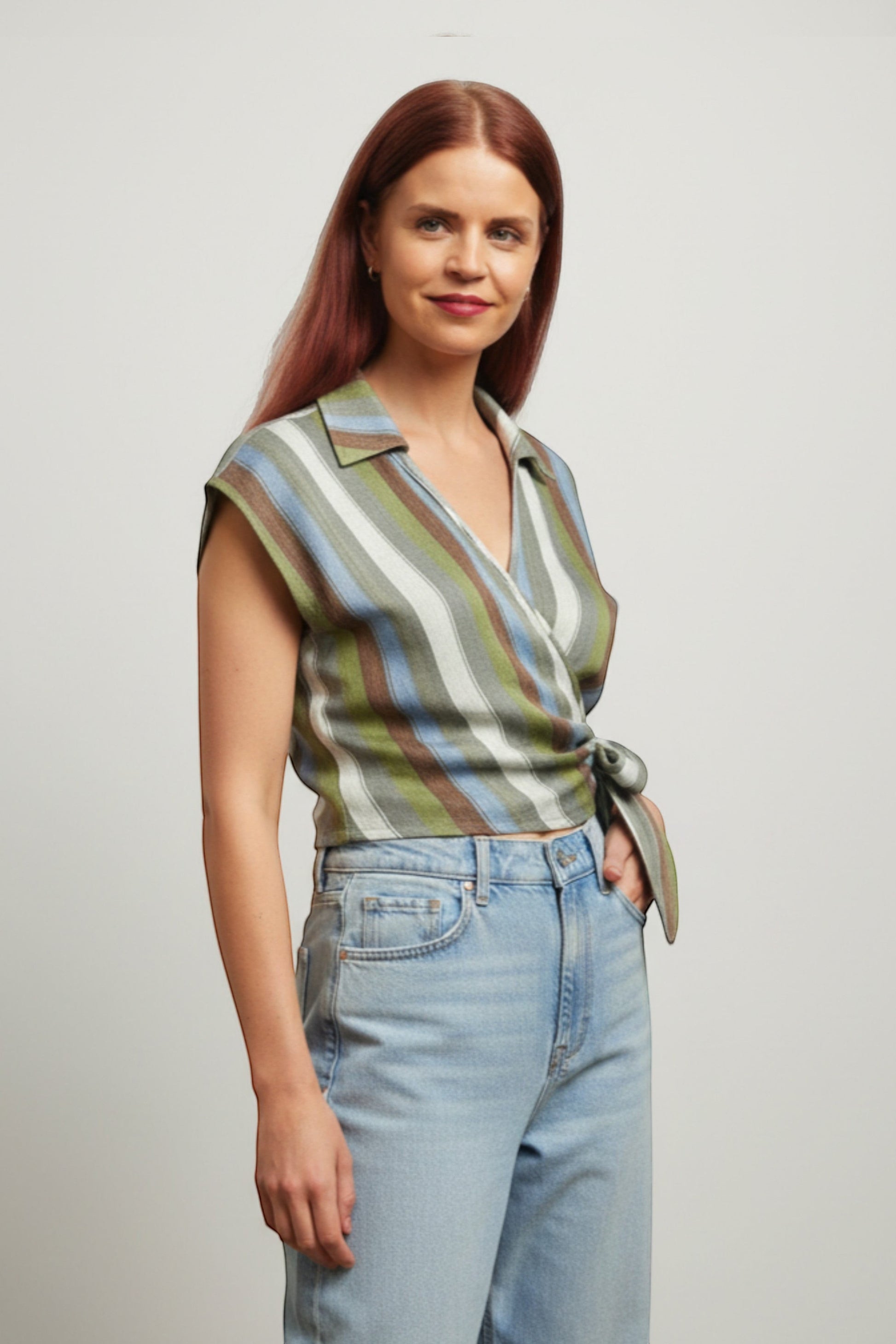 Bob & Bill green striped wrap blouse with V-neck, collar, and tie detail. Made from 85% lyocell and 15% nylon.