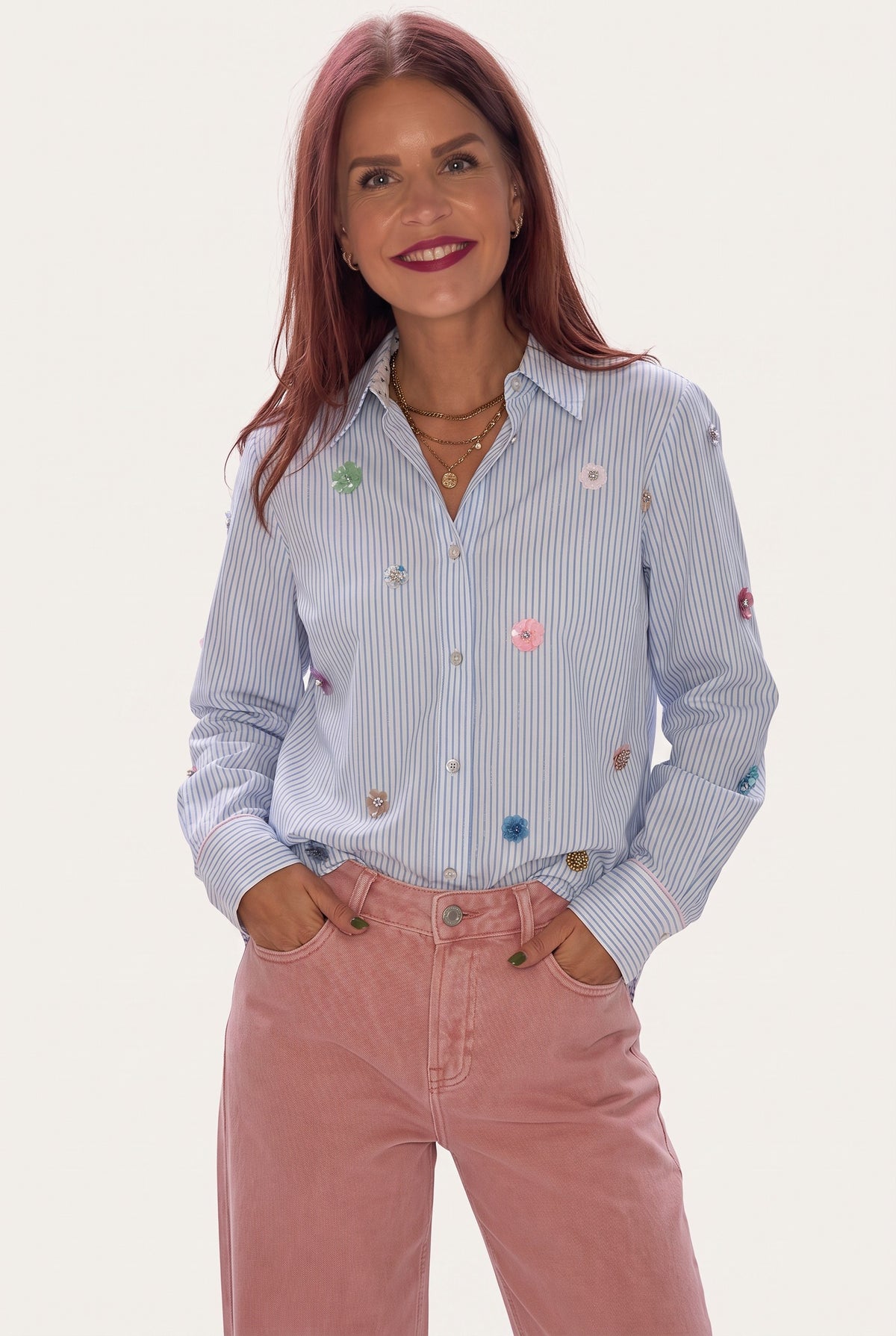 Bob & Bill Nümph Lili oversized blue striped shirt with colorful sequin floral embellishments worn by a woman