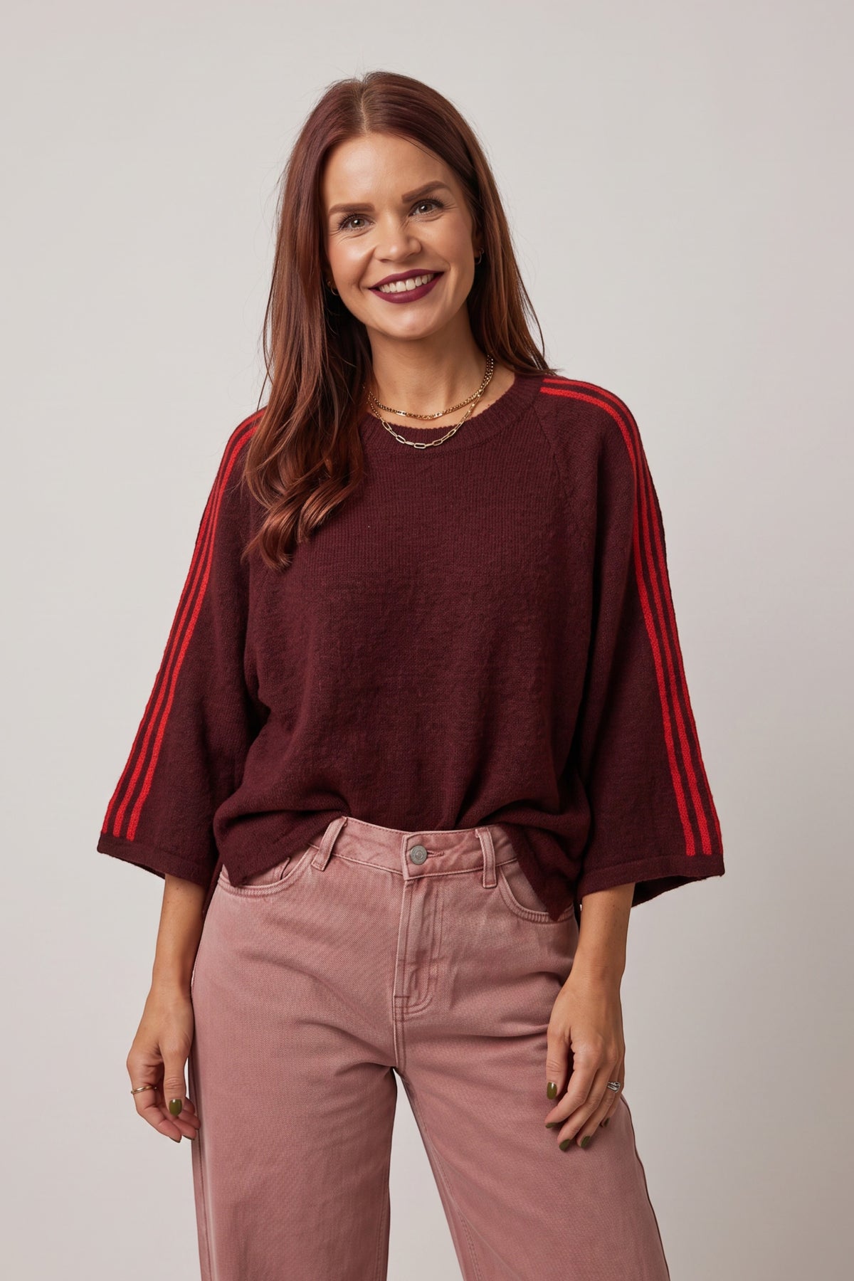 Bob & Bill LUNE knit sweater in prune with orange shoulder stripes, featuring a round neck and wide short sleeves.