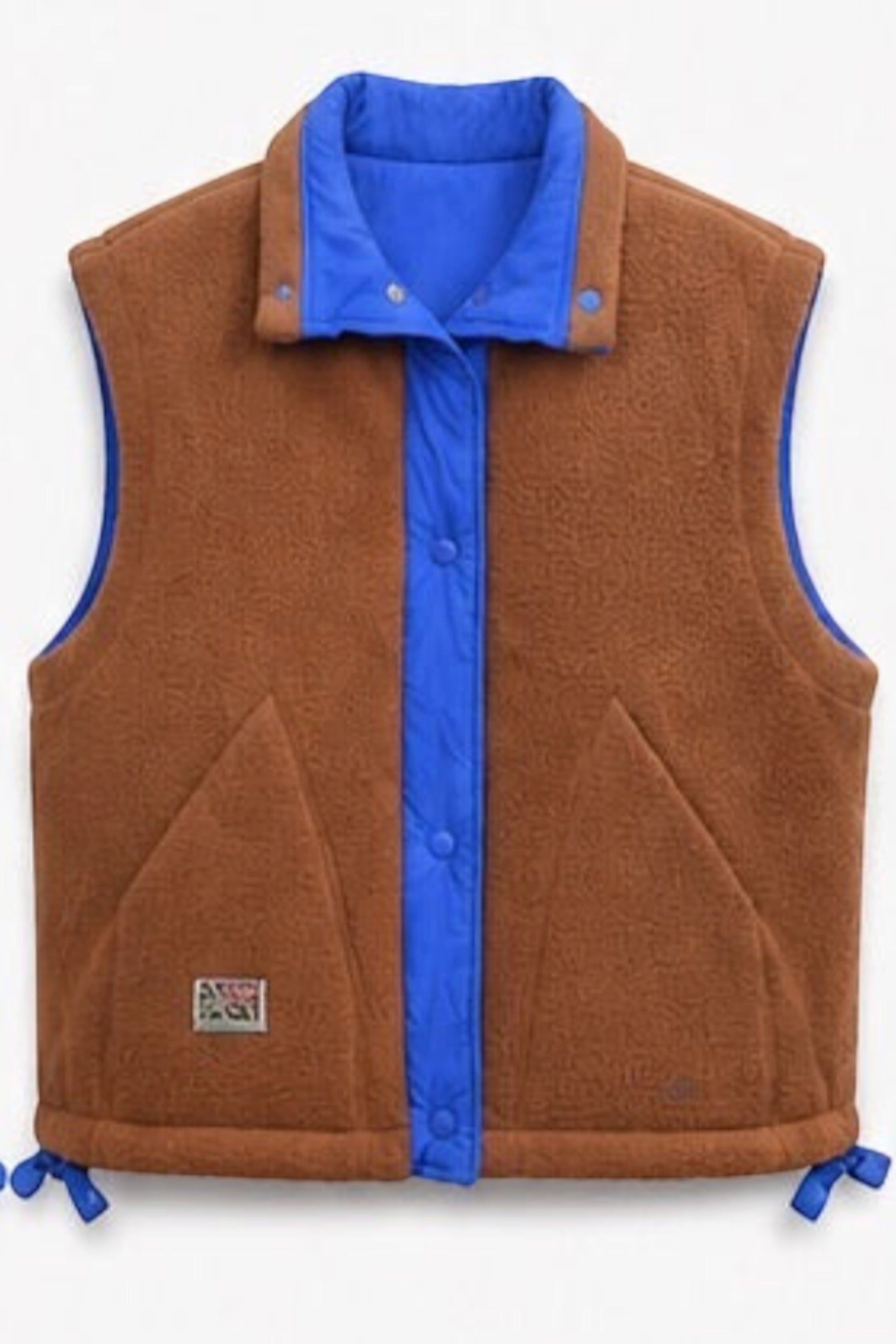 Bob & Bill reversible teddy gilet in brown and royal blue with a button-up front, collar, and adjustable hem.